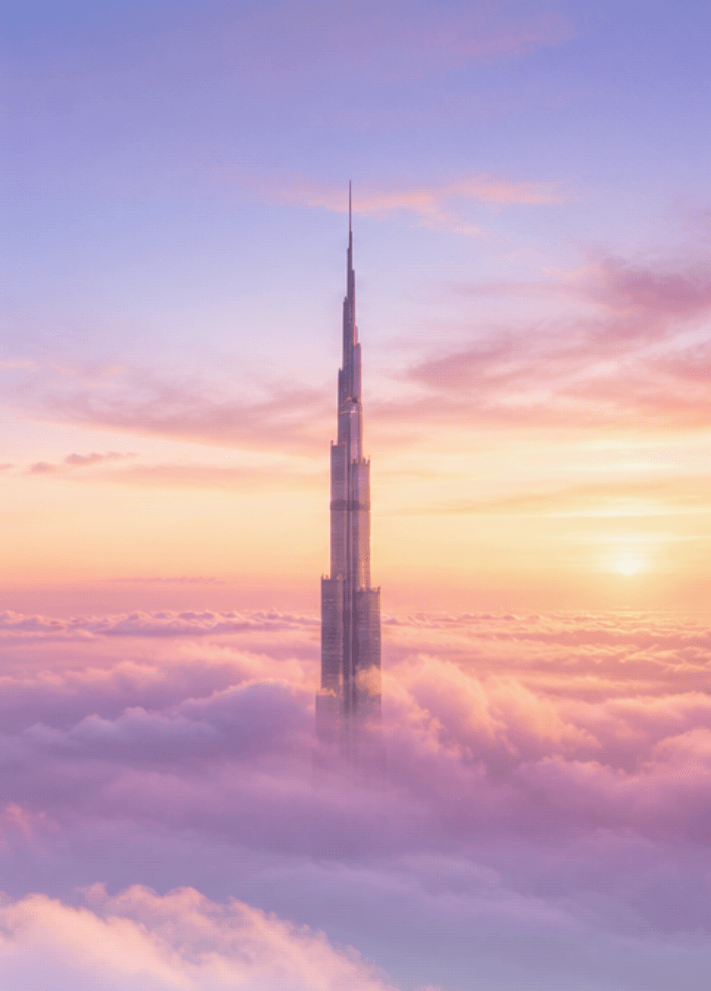 Burj Khalifa rising above the clouds at sunrise
