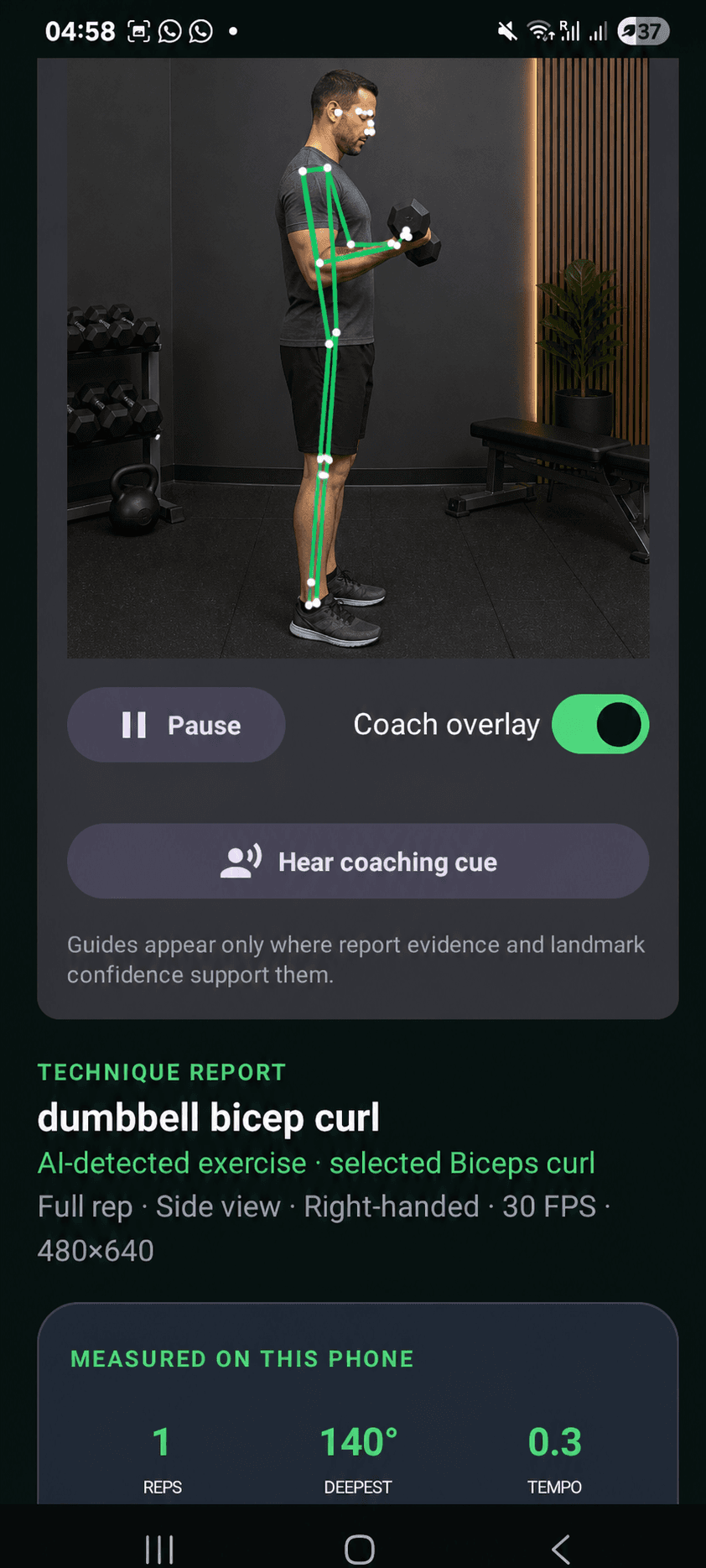 An adult athlete using FormCoach during a dumbbell curl